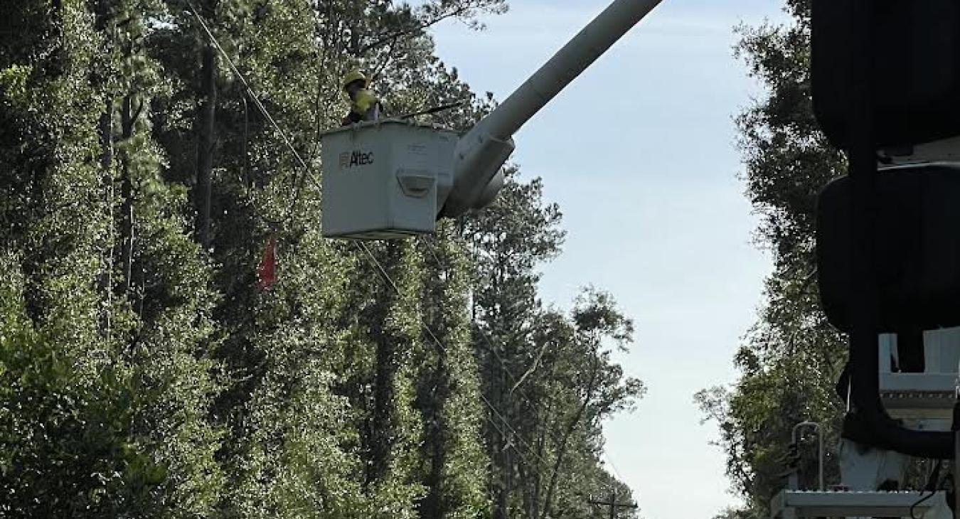 Lineworker in bucket performing repairs